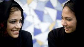Two students smiling